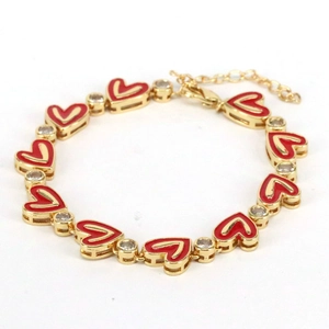 Bohemian gold chain bracelet featuring red enamel hearts and white cubic zirconia stones