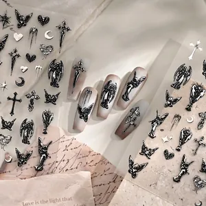 3D gothic nail stickers featuring black angels, crosses and butterflies on long nails