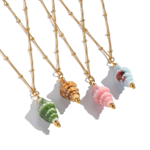 Gold beaded stainless steel necklaces with colorful conch shell pendants on white background