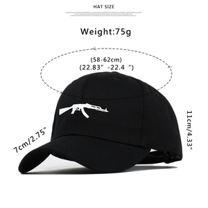Detail view of cotton baseball cap with white AK-47 rifle embroidery and size parameters