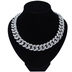 Silver 20mm Cuban link necklace with sparkling rhinestones on a black bust display