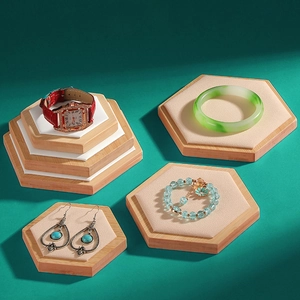 Three-piece hexagonal bamboo jewelry display trays with beige velvet lining for watches and rings