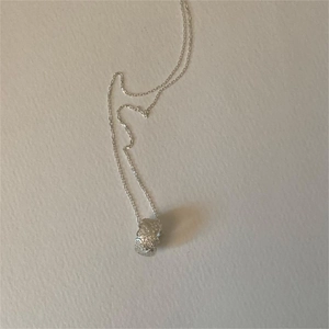 Elegant 925 sterling silver chain necklace with a textured cylindrical pendant charm