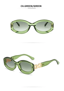 Detail of green oval frame sunglasses with gold hollow metal decoration on the temple