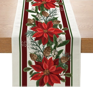 Linen Christmas table runner featuring red poinsettia flowers and pine cones