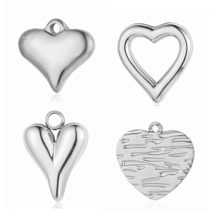 Set of four unique silver stainless steel heart pendants in various minimalist styles