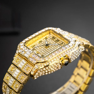 Luxurious gold-tone hip hop men's watch fully iced out with sparkling crystals in close-up