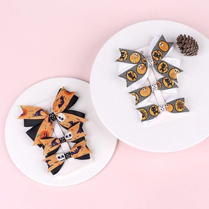 Detail of Halloween hair bows set with pumpkin, bat and spider patterns for girls