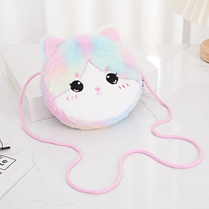 Cute colorful plush cat shoulder bag for girls with pink braided strap on a desk