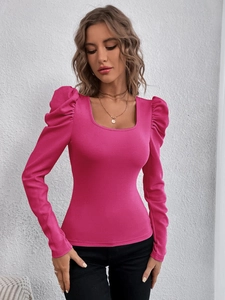 Detail of square neck and puff sleeves on a magenta knit long sleeve top for women