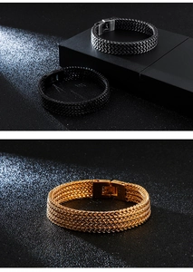 Macro view of woven stainless steel chain bracelets with heavy square clasps in gold and black
