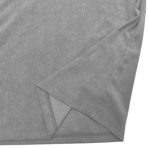 Macro shot of grey corduroy polo shirt fabric texture with detailed hemline stitching