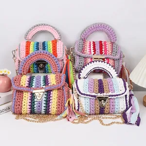 Handmade rainbow crochet crossbody bag with gold buckle and colorful fringe tassel