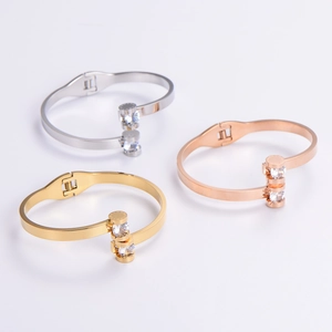 Three-tone 304 stainless steel bangles with Roman numerals and cubic zirconia inlays