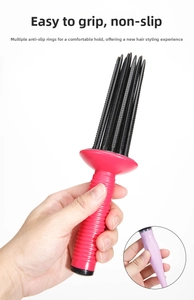 Detail of ergonomic anti-slip handle on a professional volume hair styling brush