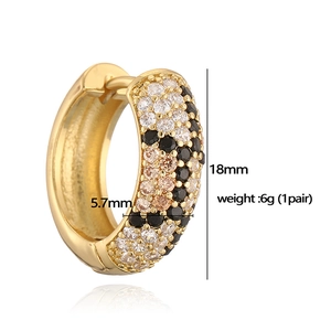 Detail view of 18mm leopard pattern gold earrings with champagne and black zircon stones