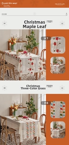 Detail of Christmas embroidered tablecloth with festive leaf patterns and wavy lace edge