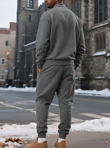 Rear view of grey men's tracksuit set with stand collar and textured diamond pattern