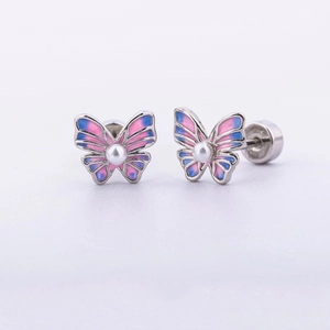 Close-up of butterfly stud earring with pink-blue gradient enamel and pearl detail