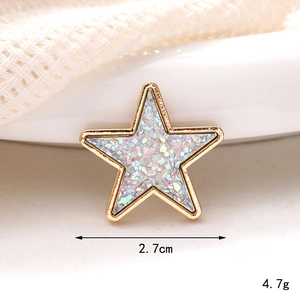 Star-shaped gold DIY jewelry accessory with iridescent blue sequins and pearl heart detail