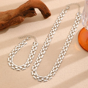 Detailed set of silver tank chain necklace and bracelet with watch strap style metal links