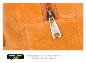 Macro view of smooth hardware zipper and durable plush fabric on the dinosaur backpack