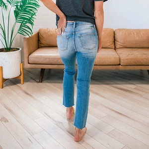 Women's light blue straight-leg jeans with a high waist and back pocket detail