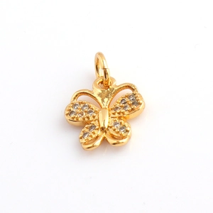 Detailed view of a gold-plated butterfly pendant with sparkling cubic zirconia inlay work