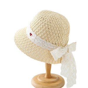 Women's woven straw sun hat with lace bow and flower decoration for summer beach travel