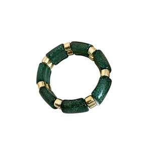 Deep green acrylic bead bracelet with shimmering glitter and golden metal spacers
