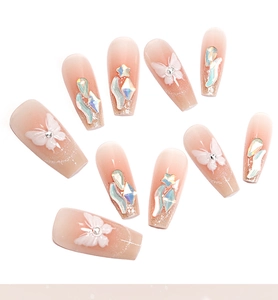 Detail of press-on nails with 3D butterflies, aurora rhinestones and silver glitter