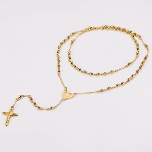 Detail of 18k gold plated rosary necklace with Mary heart link and cross pendant