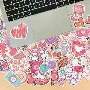 Close-up of holographic heart stickers with laser finish on a laptop for DIY decoration
