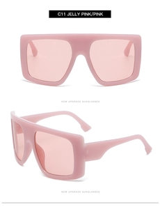 Detail view of oversized jelly pink sunglasses with integrated frame and square design