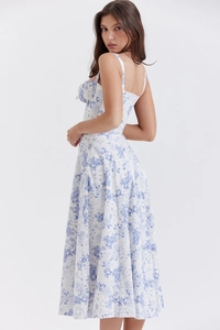 Detailed view of blue floral strap dress fabric texture and summer print pattern