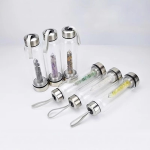Crystal glass water bottle with natural quartz pillar and stainless steel cap and base