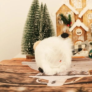 Detail showing the bottom battery compartment and power switch of a Christmas gnome