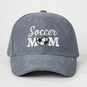 Blue corduroy baseball cap featuring white Soccer MOM heart embroidery on plain background