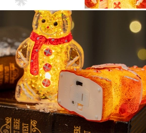Detail of LED gingerbread man decor showing power switch and battery compartment base