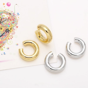 Minimalist thick C-shape clip-on earrings in polished 18k gold and silver finishes