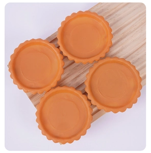 Set of four realistic PVC egg tart crust models with scalloped edges for DIY food displays
