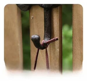 Close-up of the smooth rounded tip on this vintage cast iron owl wall hook for safety