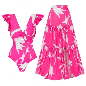 Two-piece hot pink swimsuit set with floral print ruffle top and layered maxi skirt