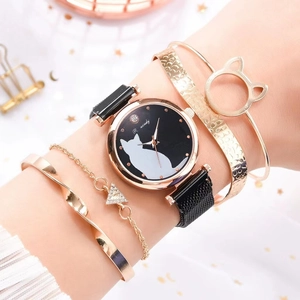 Women's rose gold quartz watch with black cat dial and matching bracelet set on wrist