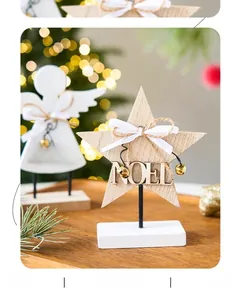 Close-up of wooden Christmas Angel and Star table decor with NOEL and XMAS lettering