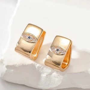 Macro shot of gold-plated square evil eye hoop earrings with micro-set zircon details