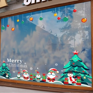Autocollants de Noël avec Père Noël, bonhomme de neige et sapin sur fenêtre en verre