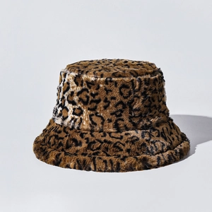 Close-up of plush gradient leopard print bucket hat showing soft faux fur texture