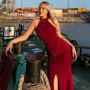 Elegant burgundy sleeveless halter neck slim fit maxi dress with side ruching and high slit