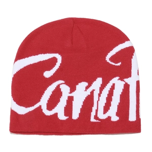 Detailed knit texture and white Carat jacquard pattern on a red beanie hat
